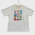 Gray t-shirt with colorful flag designs on a gray background