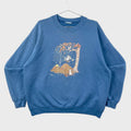 Blue sweatshirt with a graphic design on a gray background