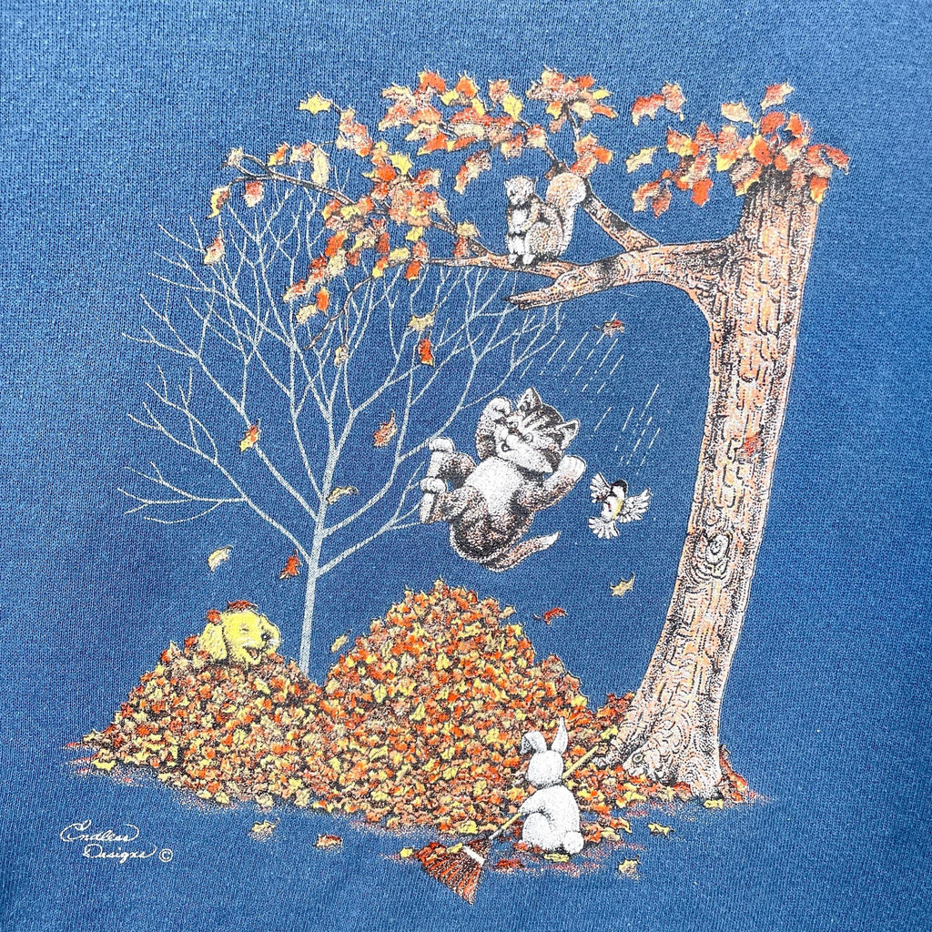 Illustration of cats playing with leaves on a blue background