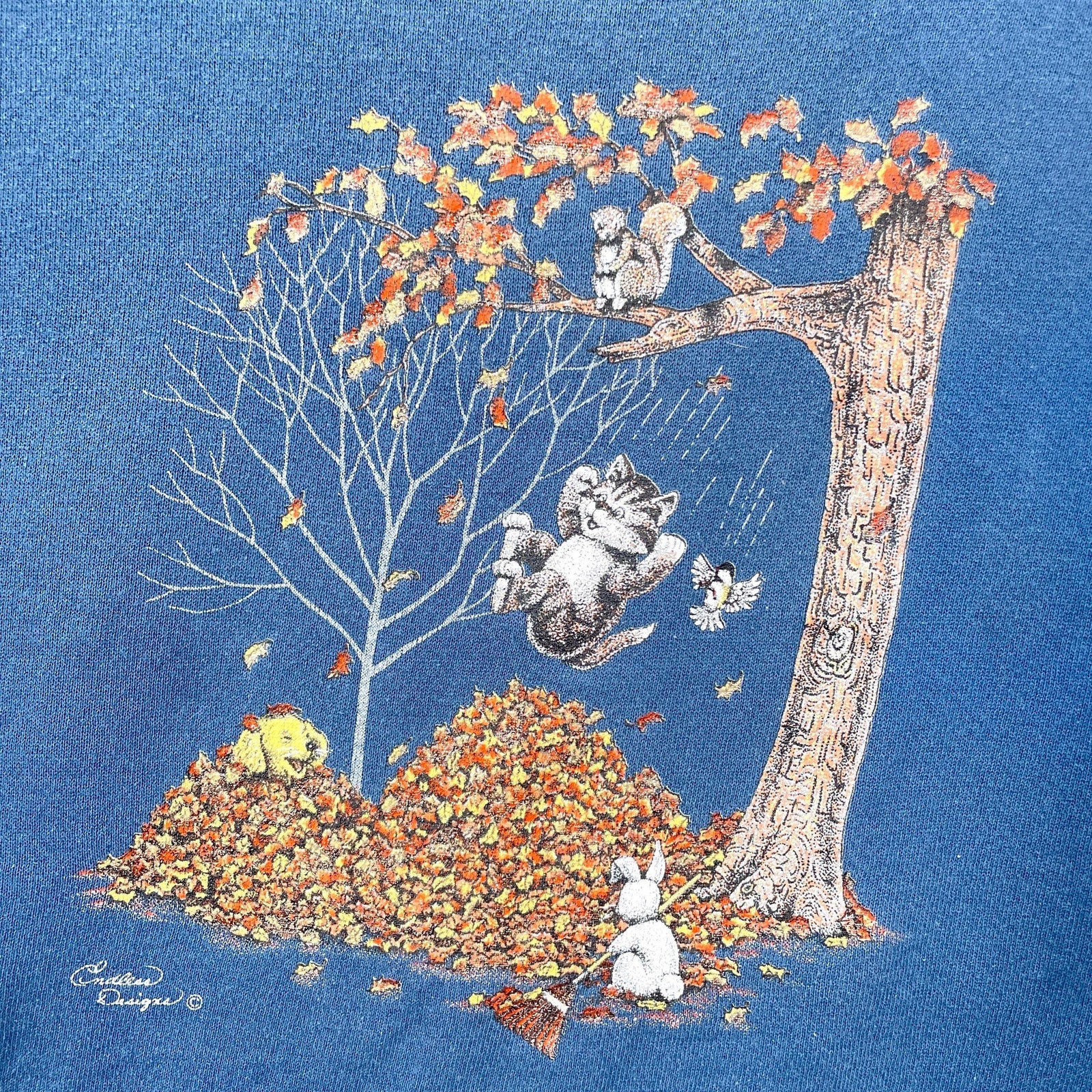 Illustration of cats playing with leaves on a blue background