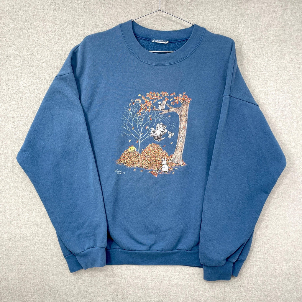Blue sweatshirt with a graphic design on a light gray background