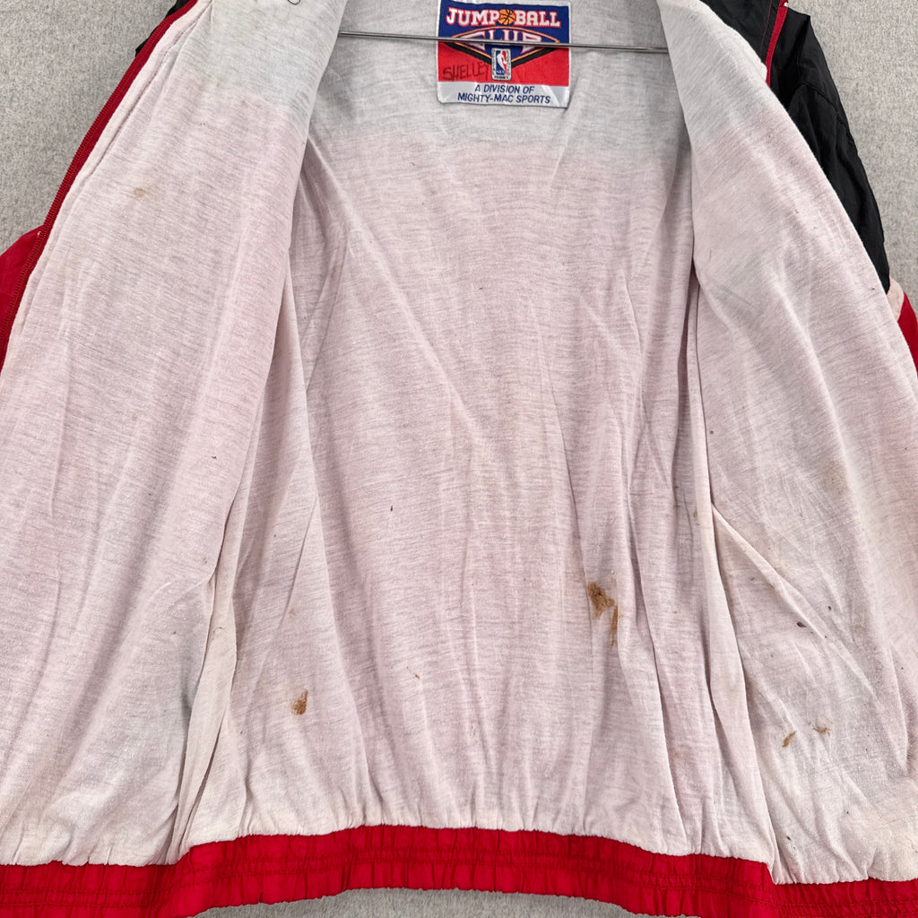 inside lining of jacket has dark stain spots