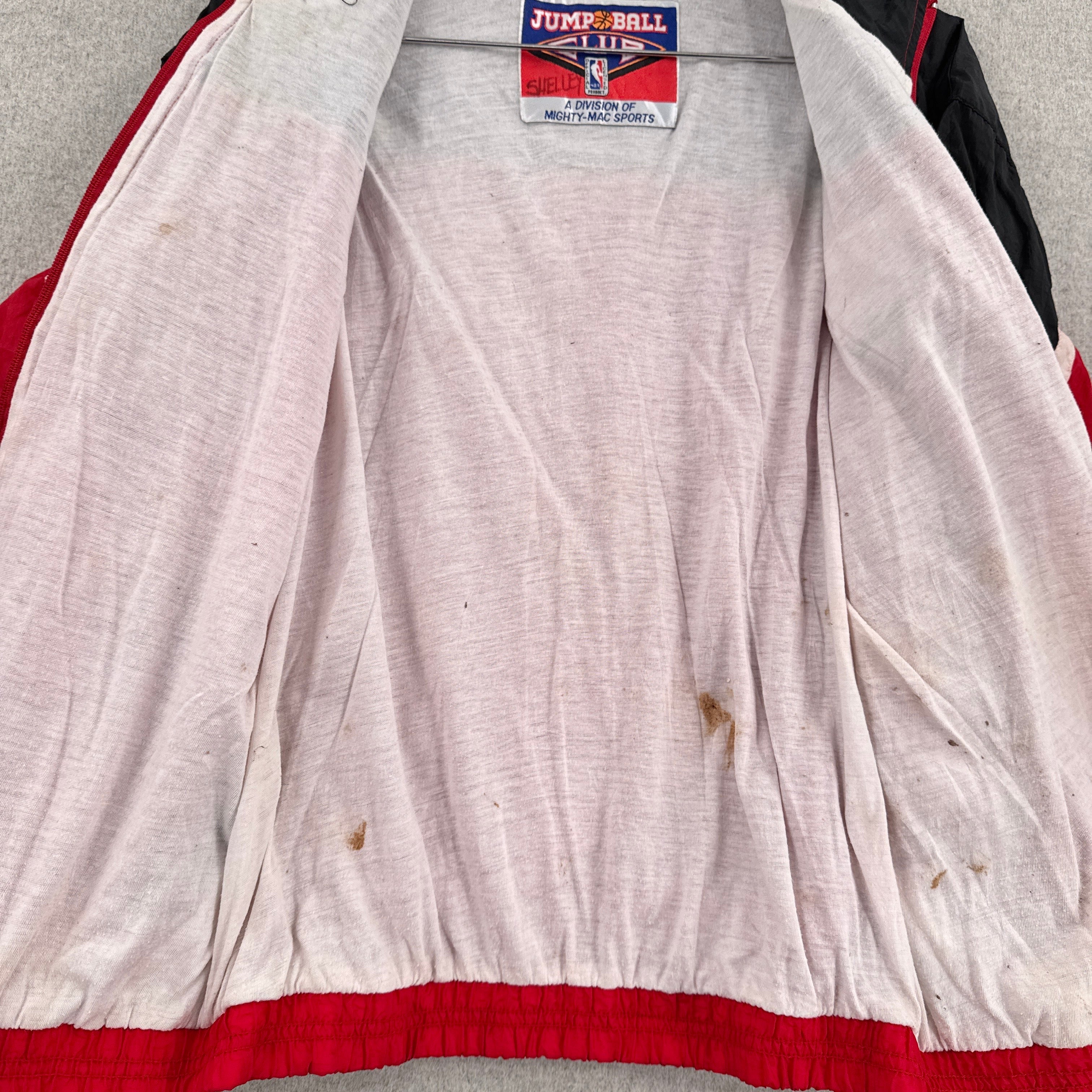 inside lining of jacket has dark stain spots