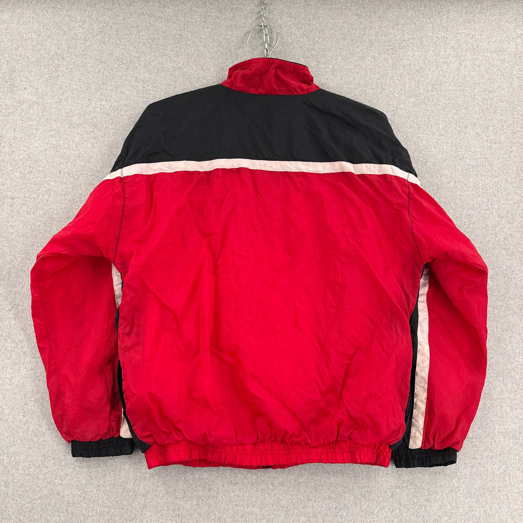 Red and black jacket with white trim on a gray background