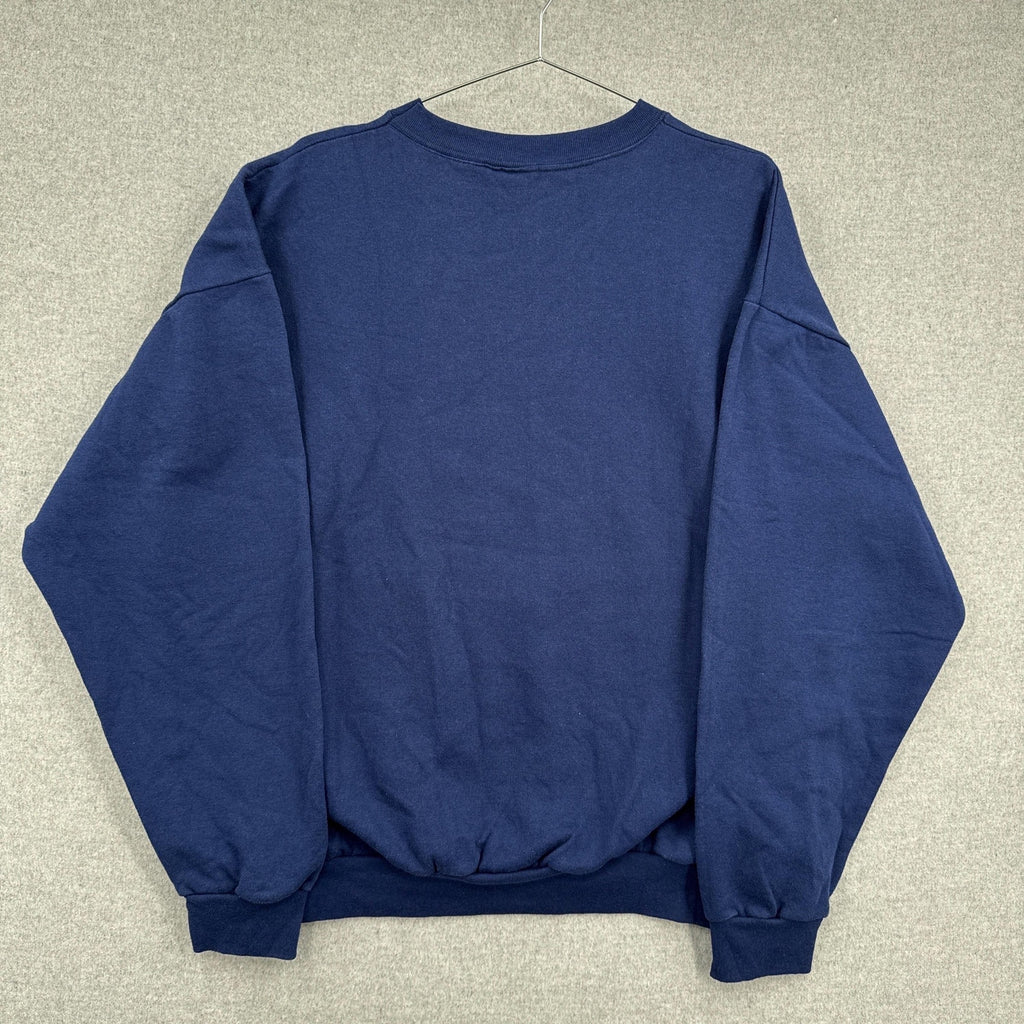 Blue sweatshirt on a hanger against a neutral background