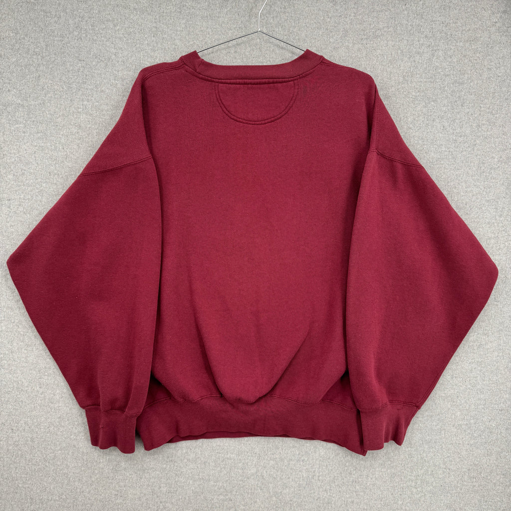 Maroon sweatshirt on a hanger against a gray background