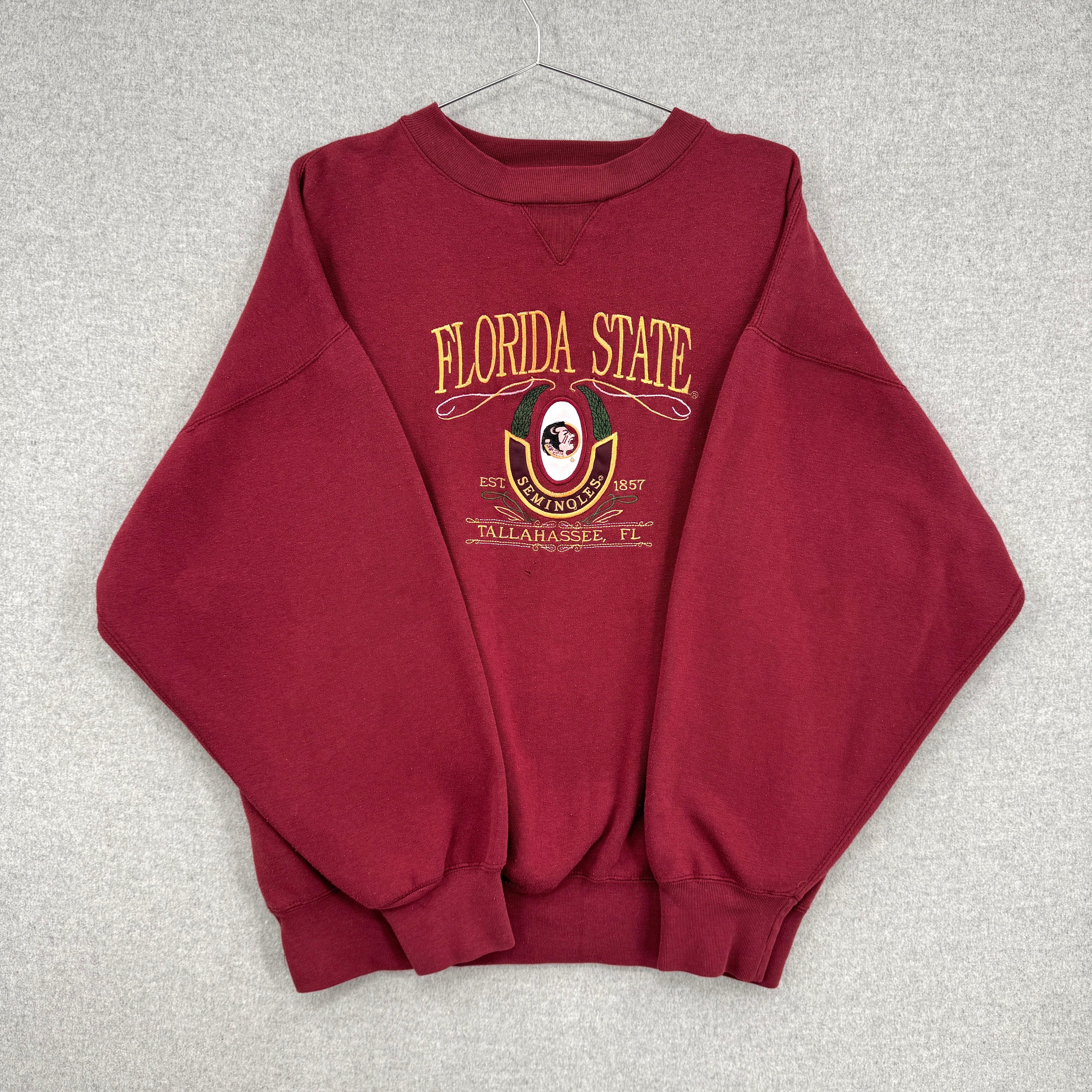 Red sweatshirt with 'Florida State' text and logo on a gray background