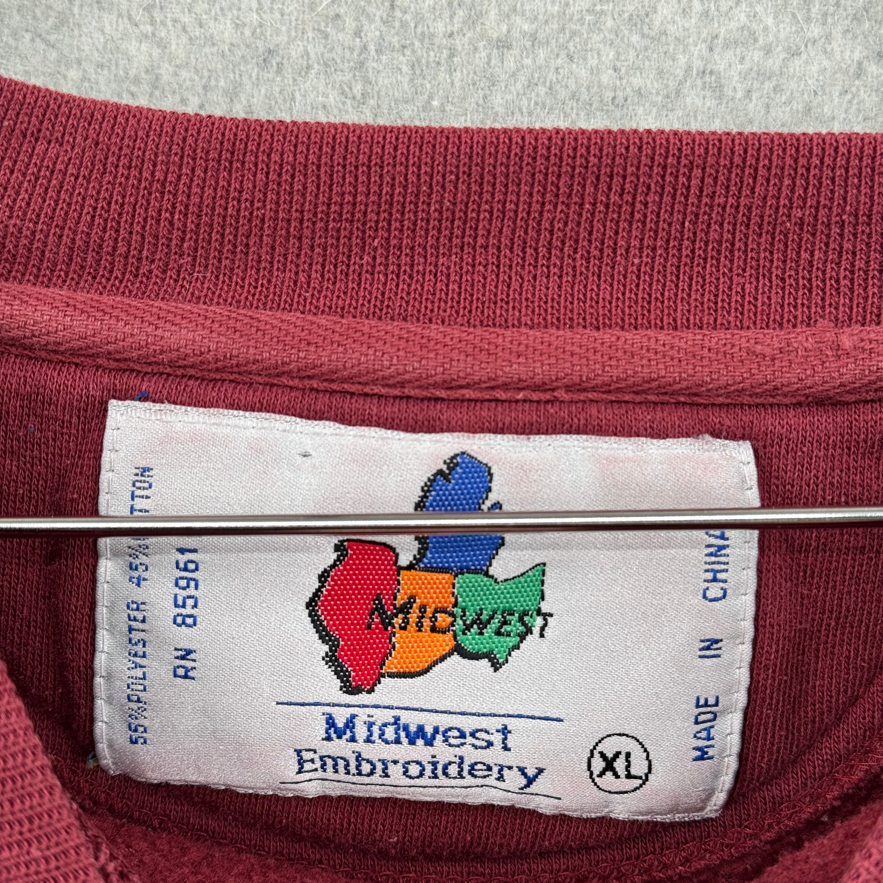 Label with 'Midwest Embroidery' logo on a maroon garment. Size XL