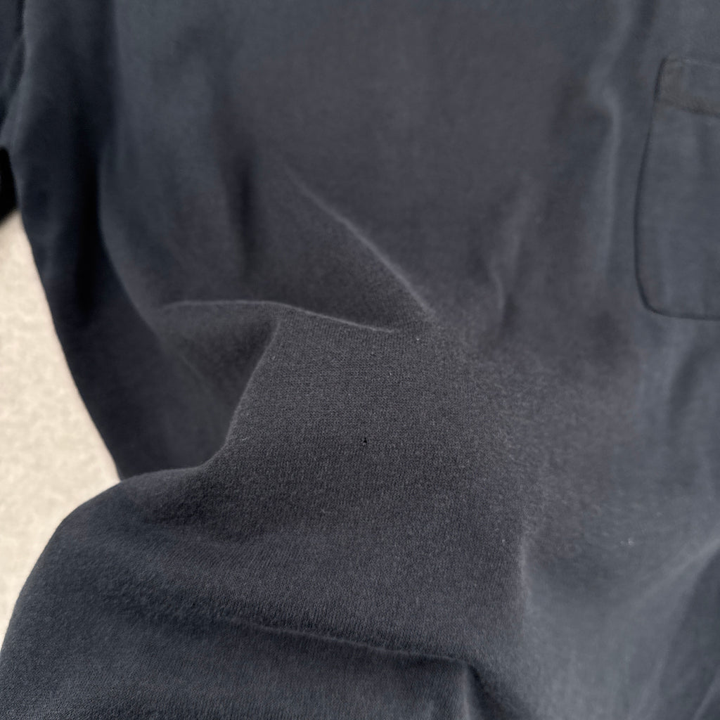 close up of a tiny hole in shirt