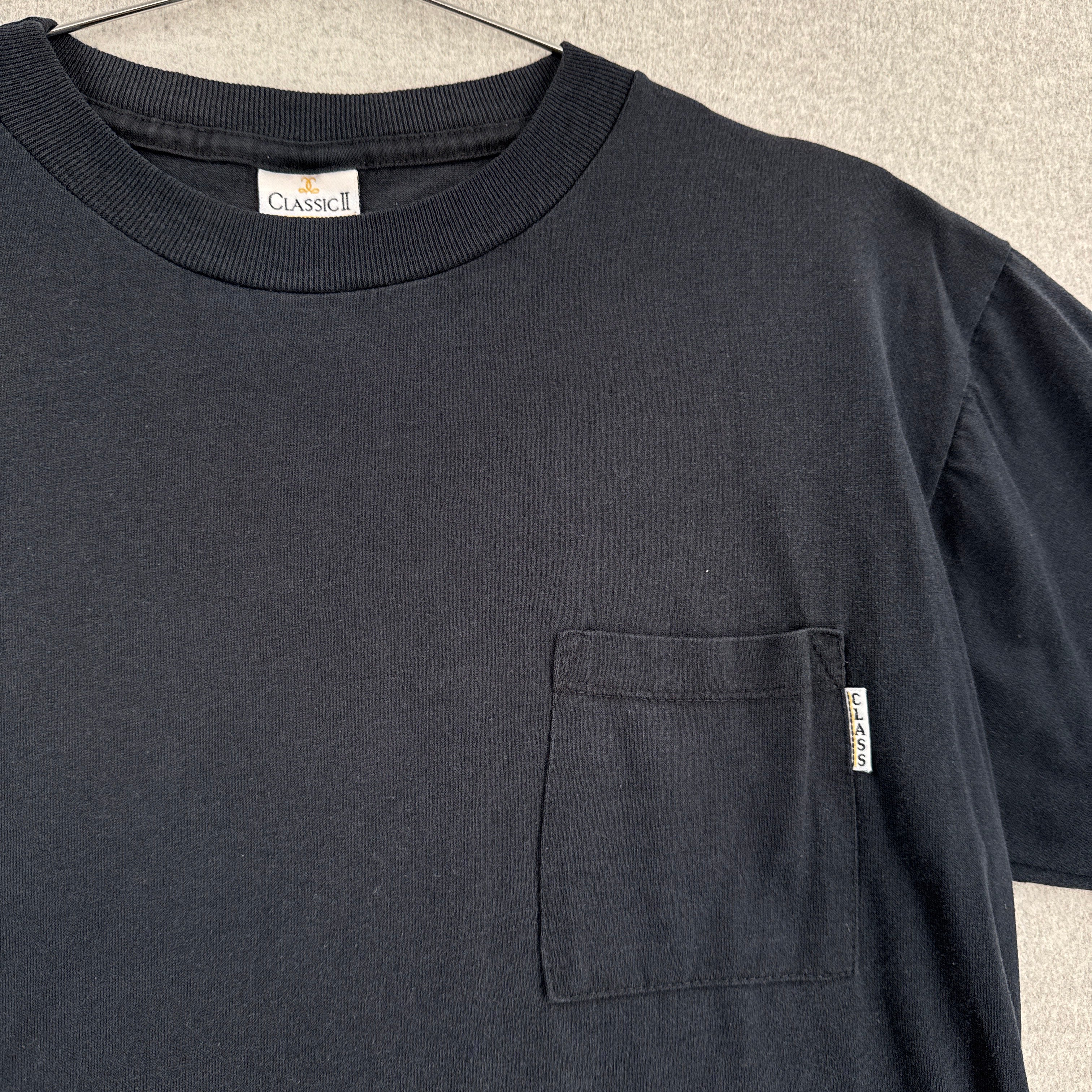 Black shirt with a pocket and visible brand label