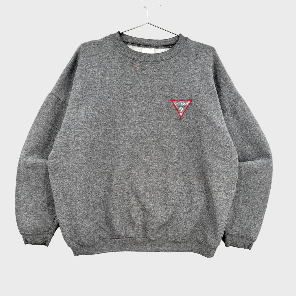 Gray sweatshirt with a red triangle Guess? logo on a gray background