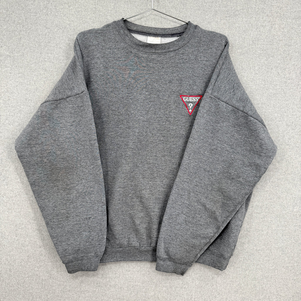 Gray sweatshirt with a small logo on a light gray background