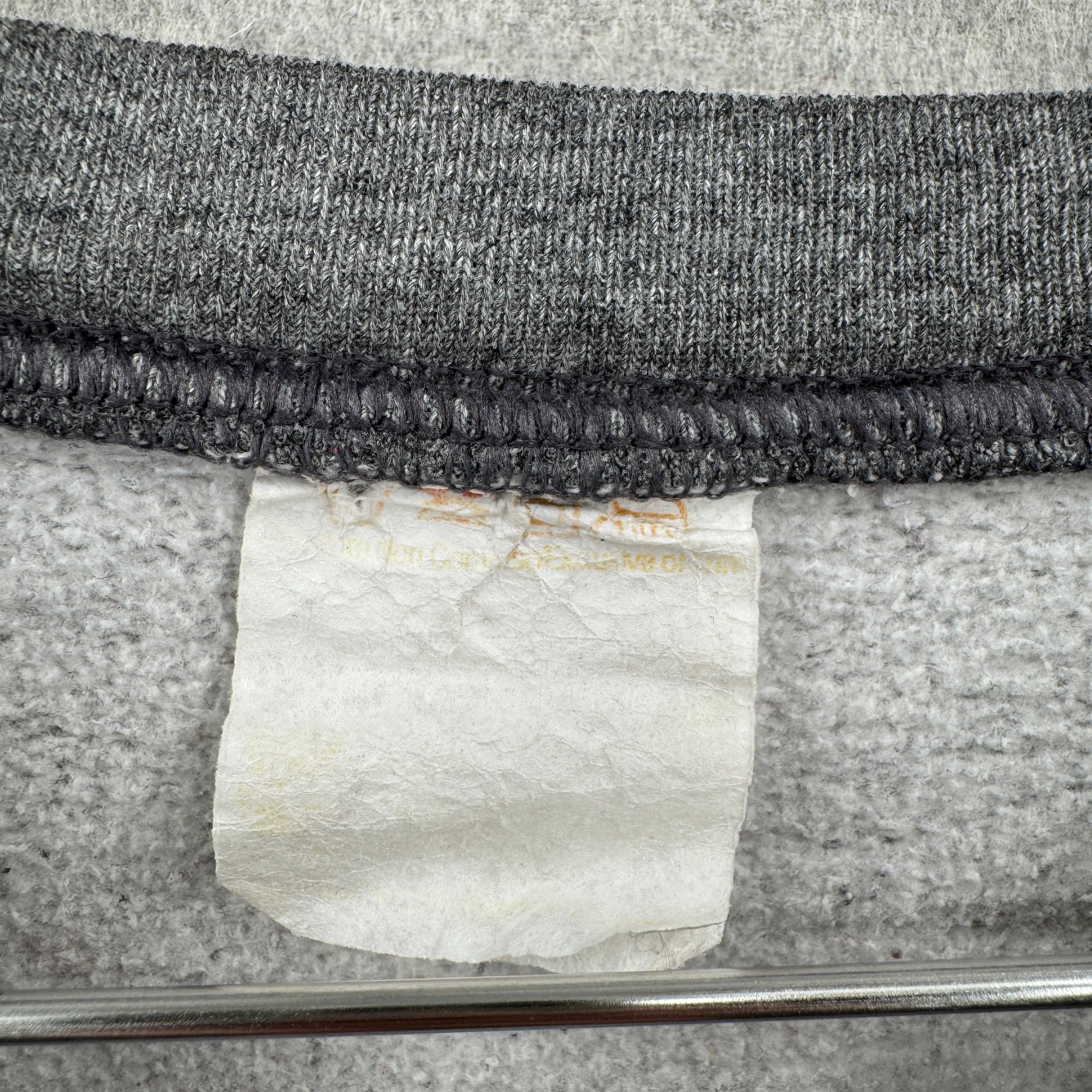 Close-up of a faded tag