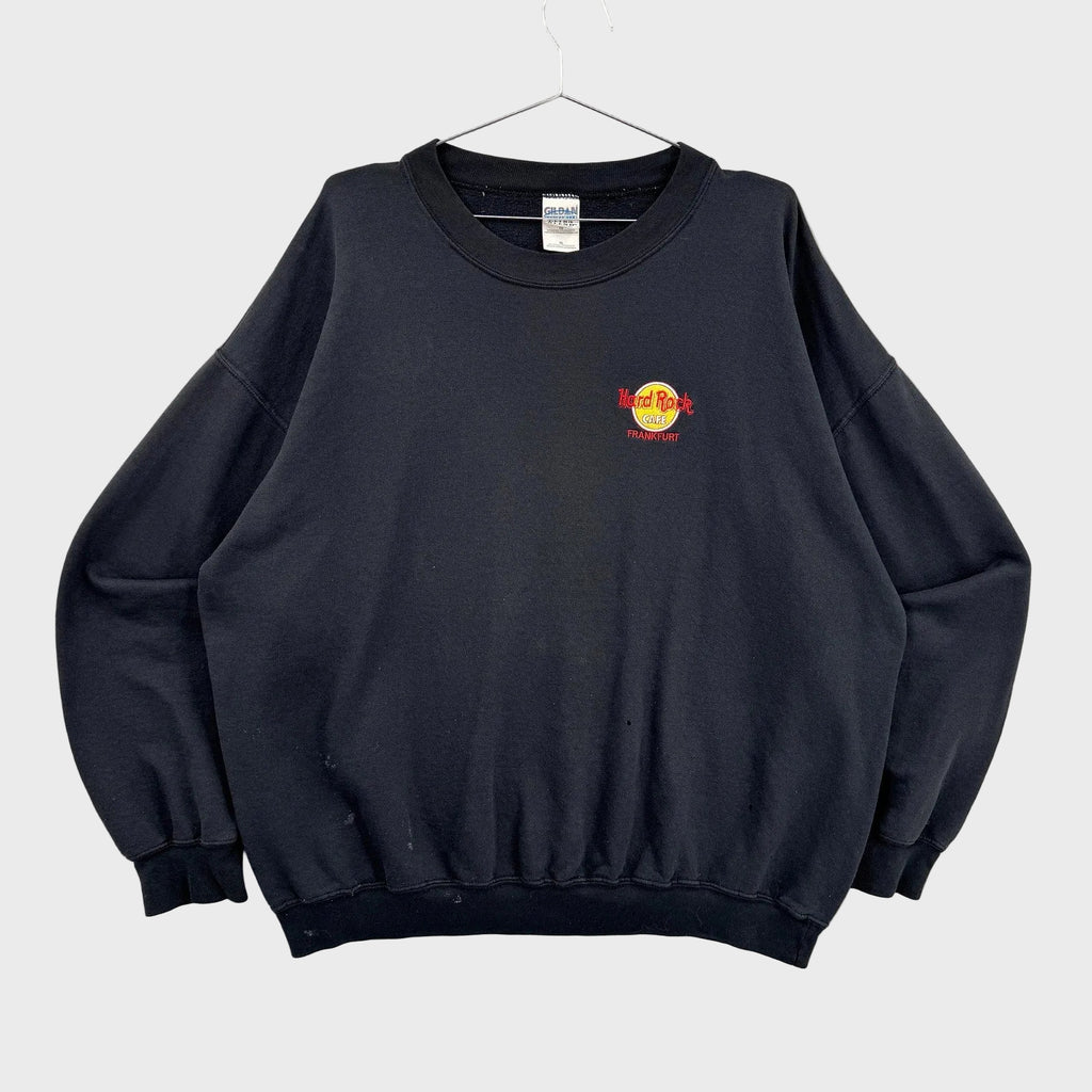 Black sweatshirt with a logo on a gray background
