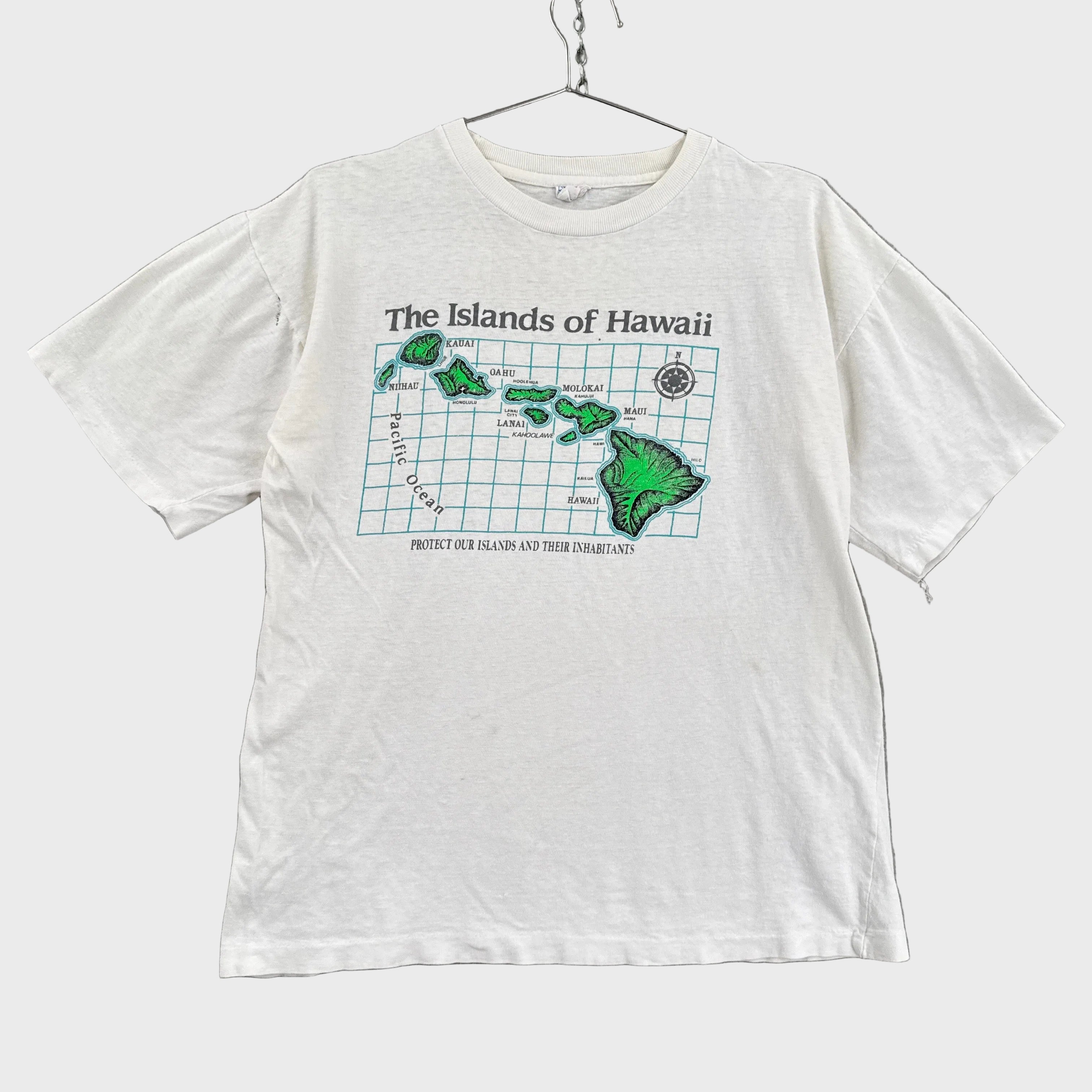 White t-shirt with a graphic design of the Islands of Hawaii on a gray background