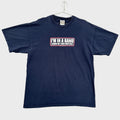 Navy blue t-shirt with text on a beige background