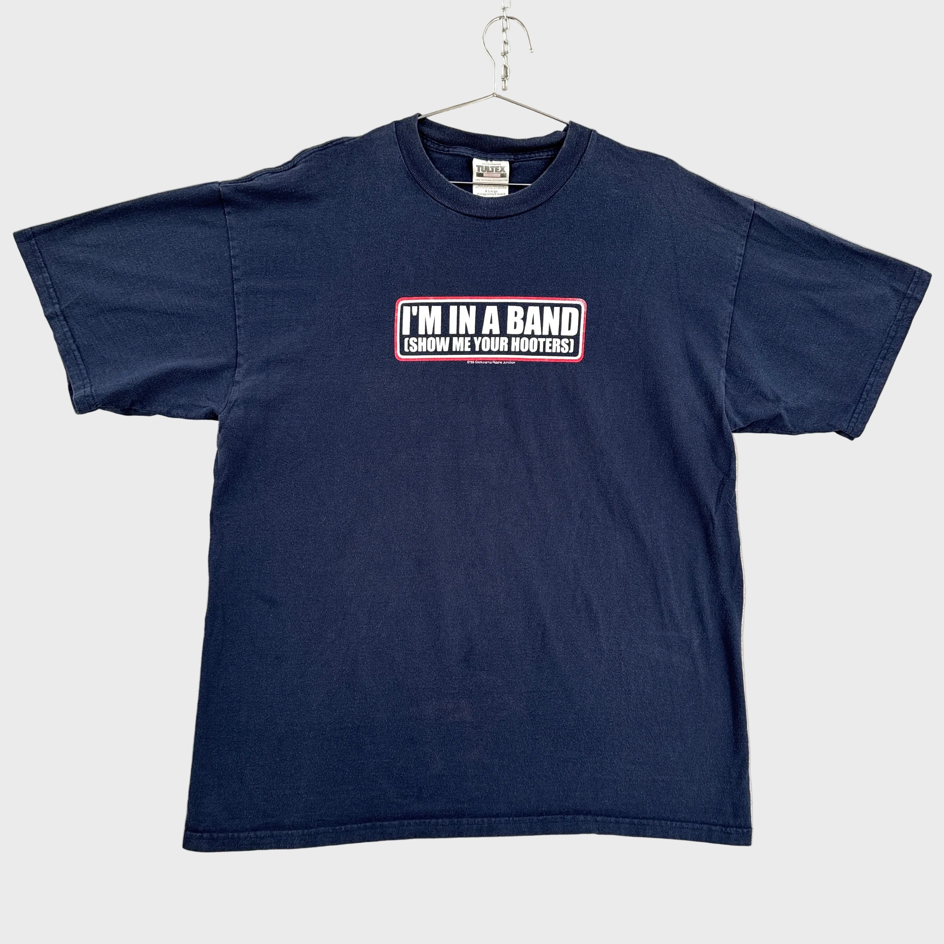 Navy blue t-shirt with text on a beige background