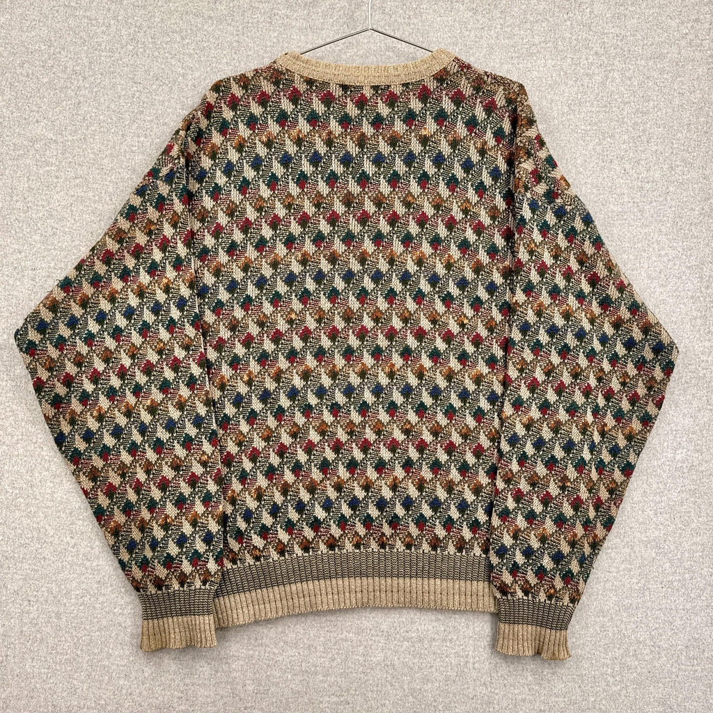 Multicolored patterned sweater on a textured surface
