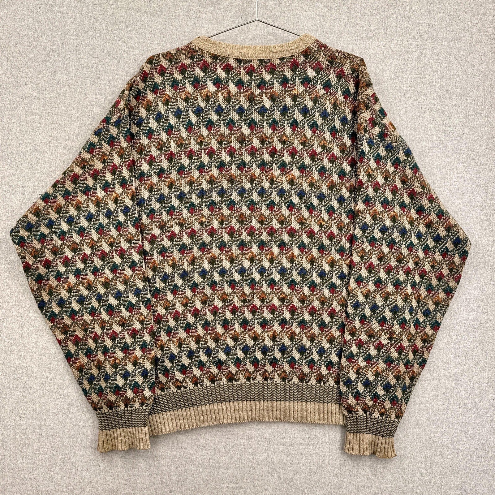 Multicolored patterned sweater on a textured surface