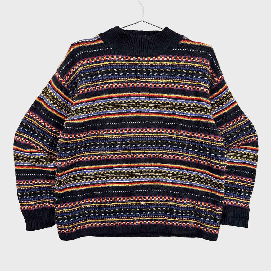 Multicolored patterned sweater on a gray background