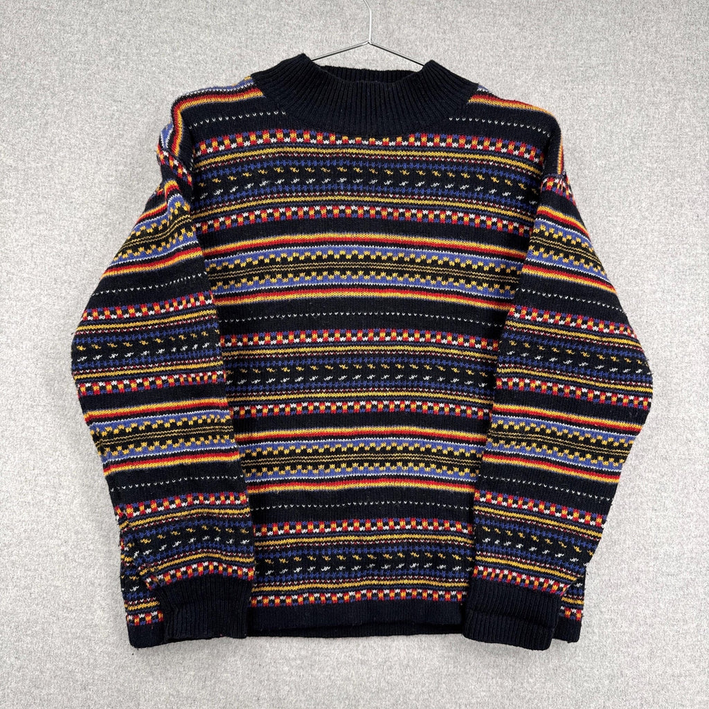 Multicolored patterned sweater on a gray background