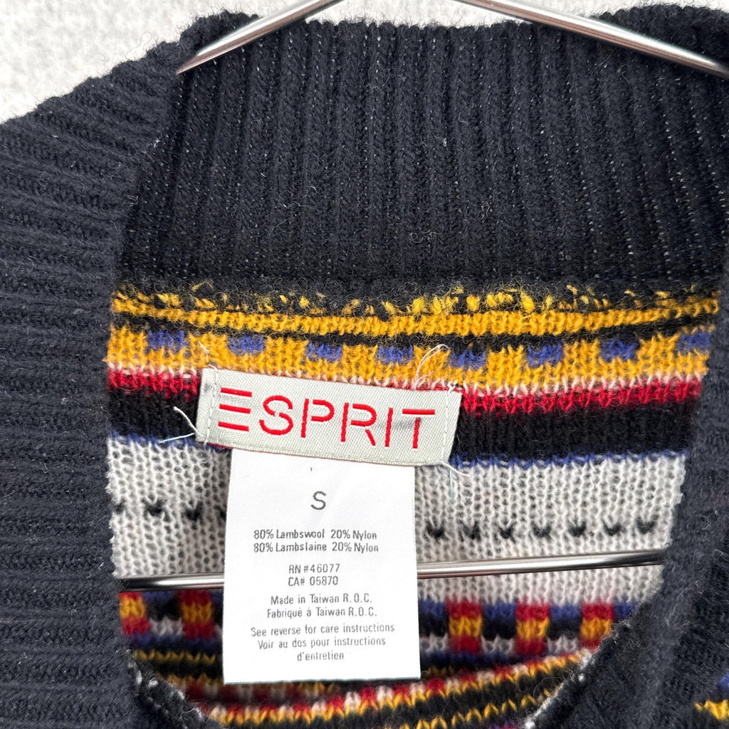 Black sweater with colorful pattern and Esprit label on a hanger. size small