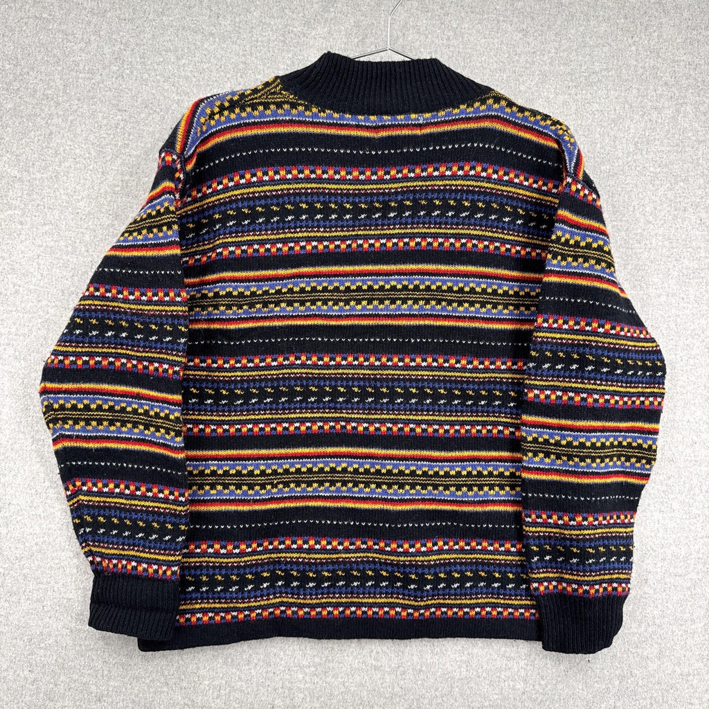 Multicolored patterned sweater on a light gray background