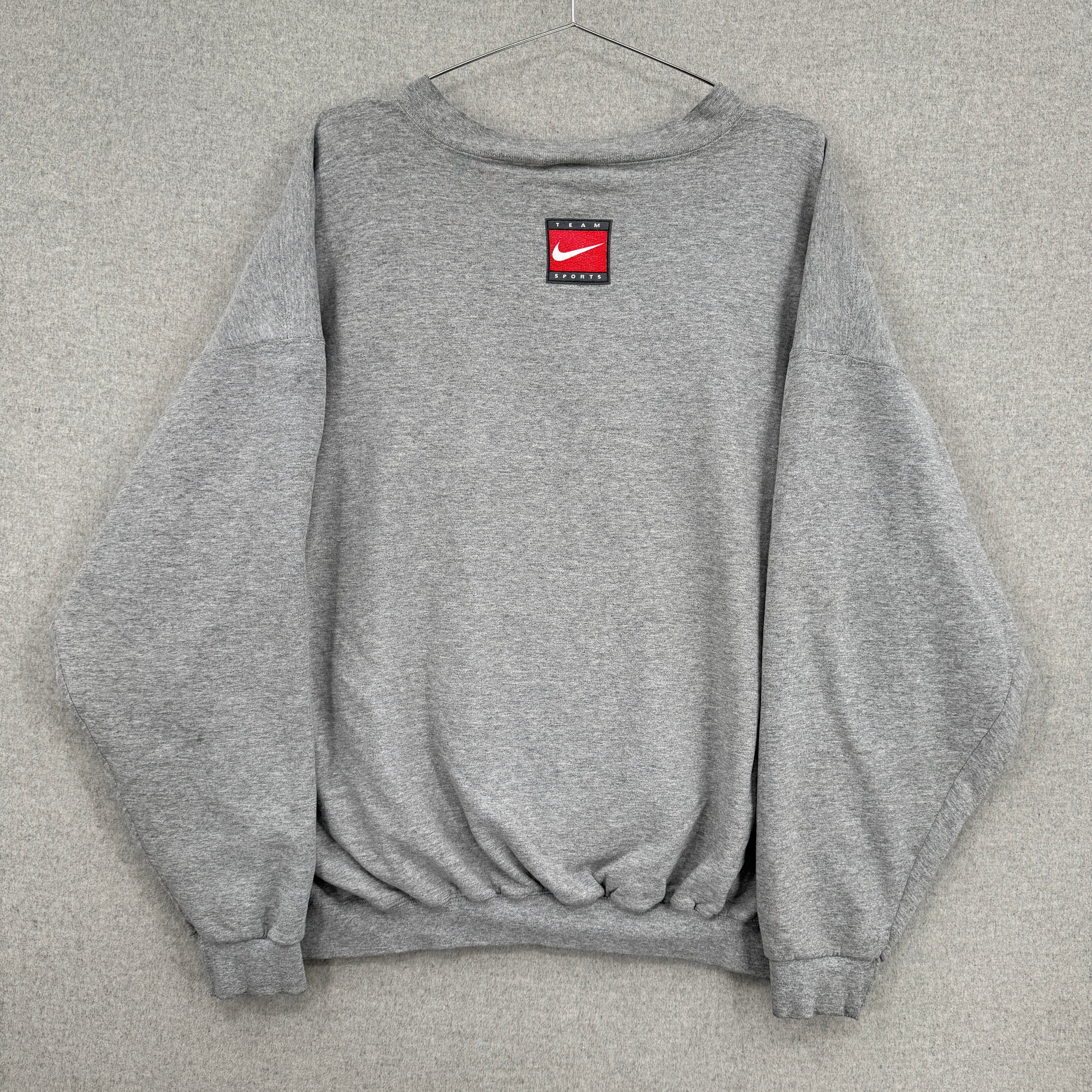 Gray sweatshirt with a red and black logo on a gray background