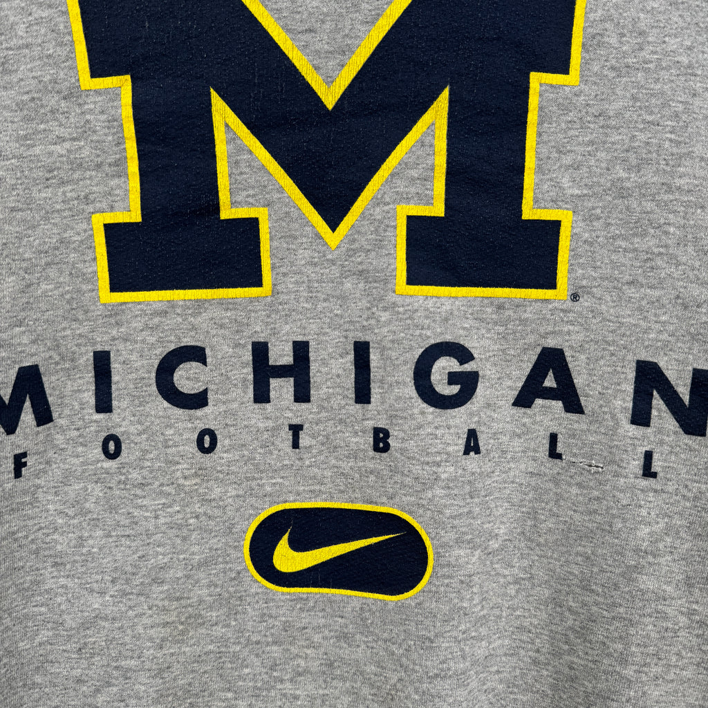 Gray sweatshirt with Michigan football text and Nike logo