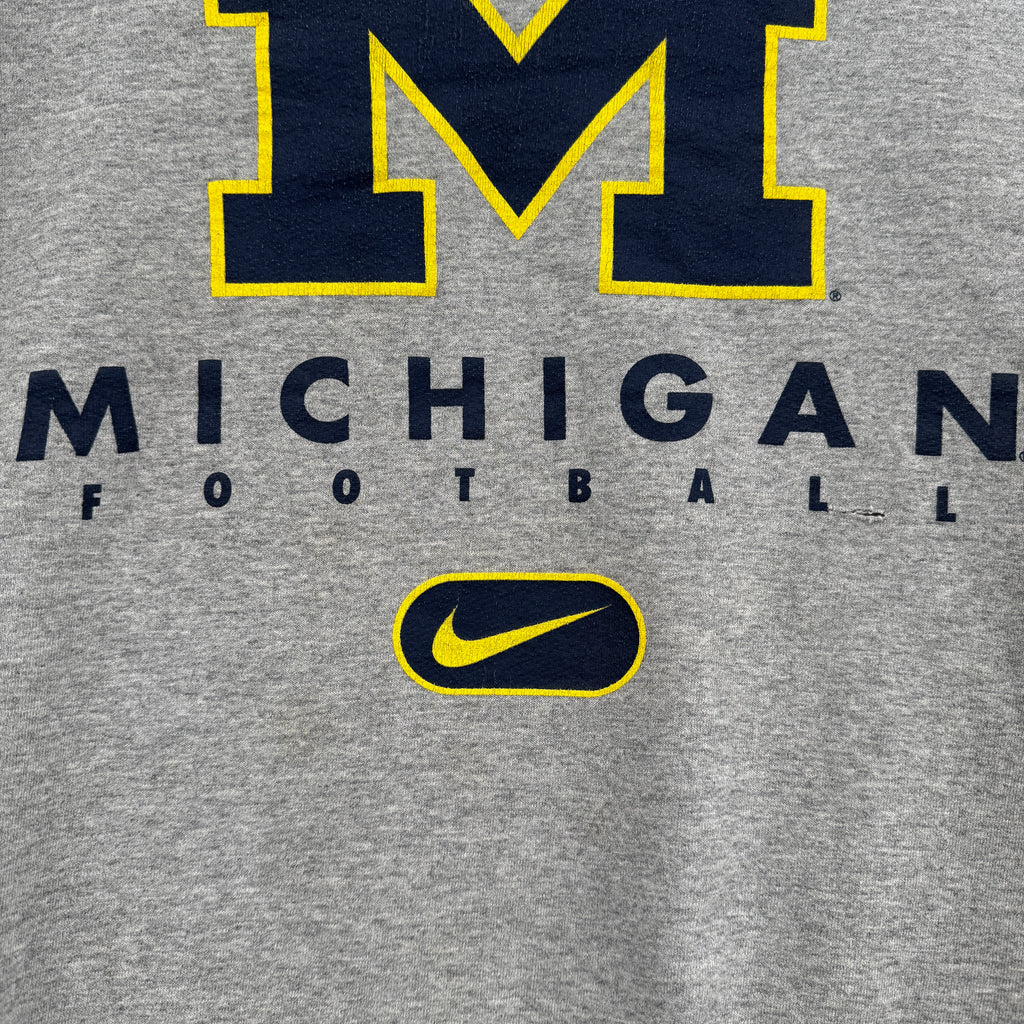 Gray sweatshirt with Michigan Football text and Nike logo on a gray background