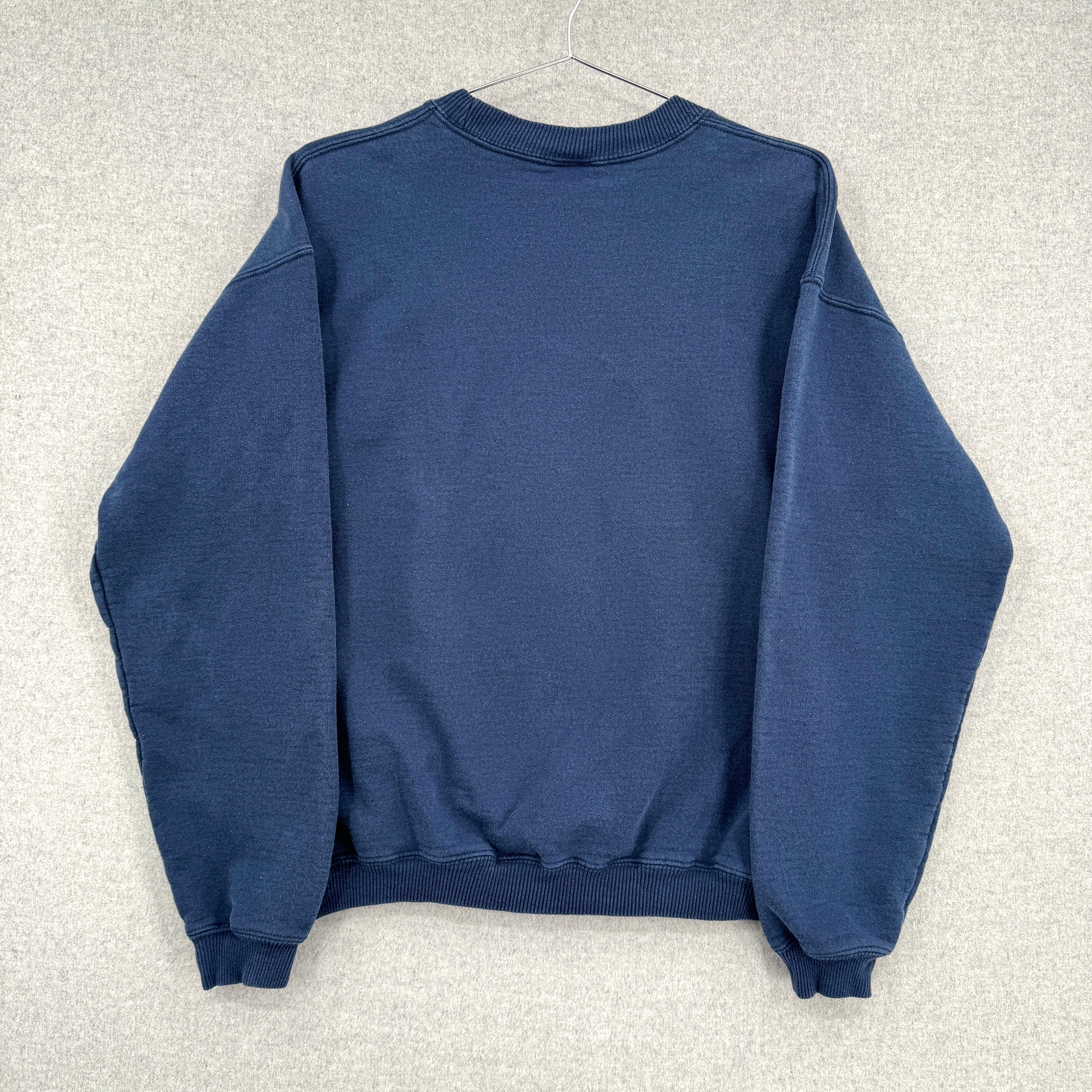 back of blue crewneck sweatshirt, blank, no design