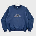 Blue sweatshirt with 'Nanaimo, B.C.' text and logo on a gray background. British Columbia souvenir with Orca Killer Whale