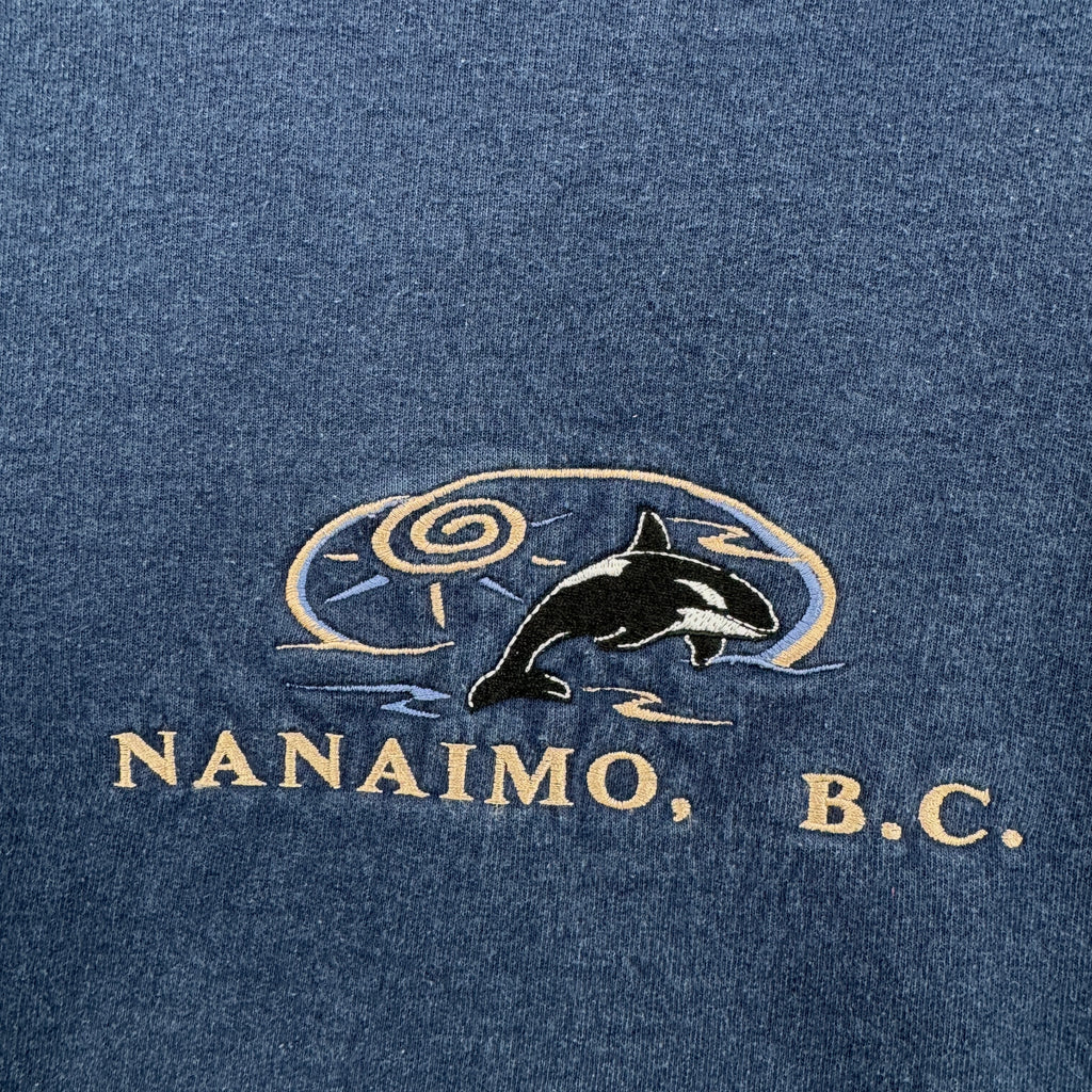 Blue fabric with a whale design and 'Nanaimo, B.C.'