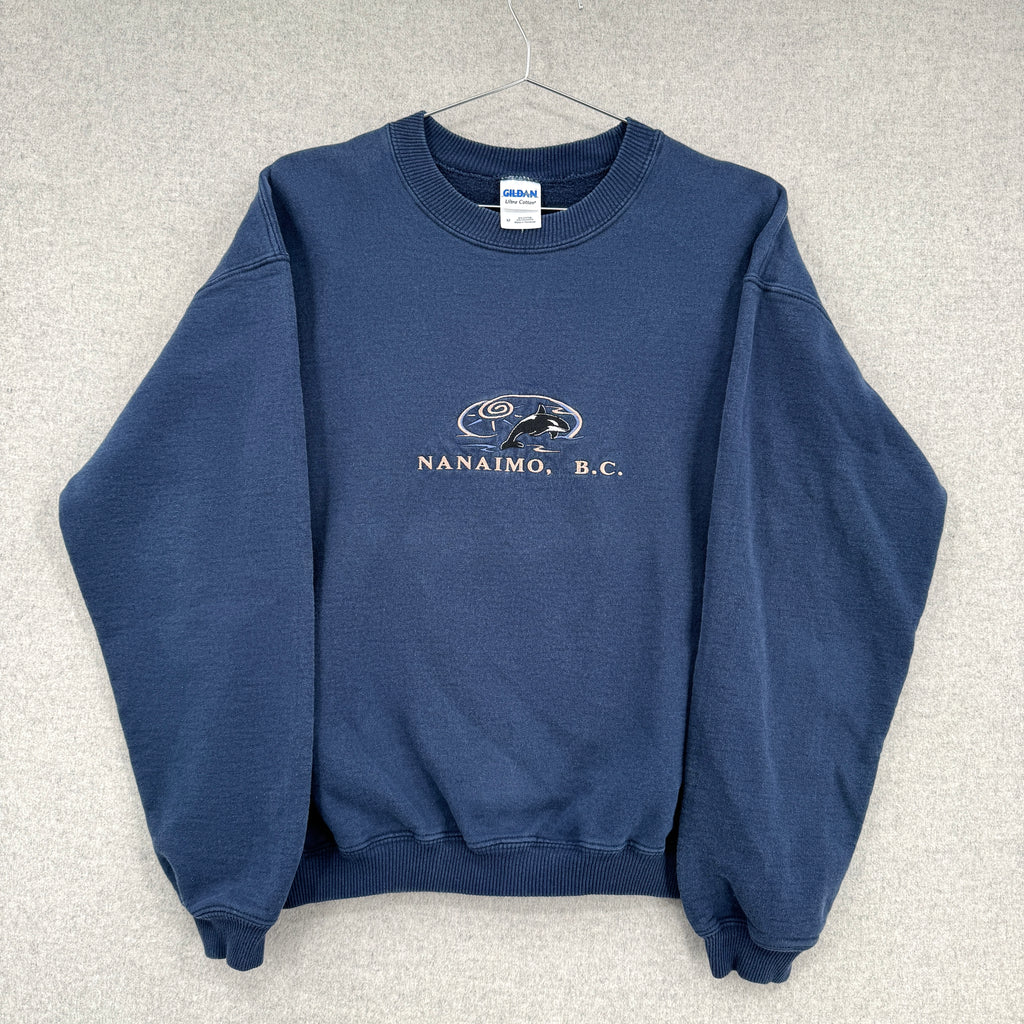 Blue sweatshirt with 'Nanaimo, B.C.' text and logo on a gray background