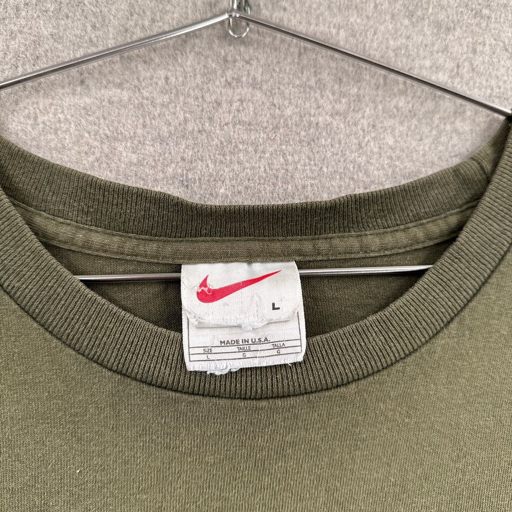 Green sweatshirt with a Nike label on a hanger. size Large made in USA