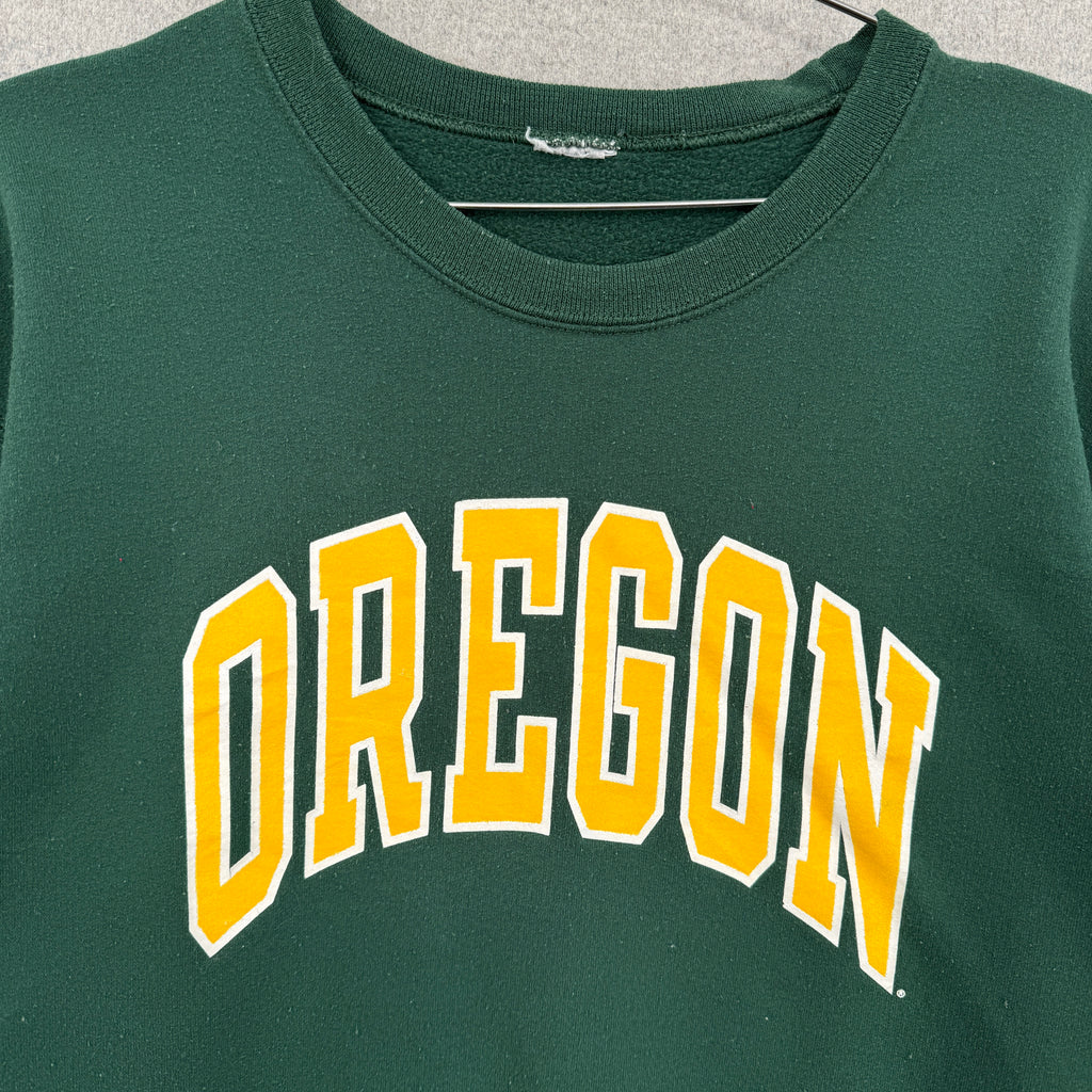 Green sweatshirt with 'OREGON' printed in yellow on a gray background