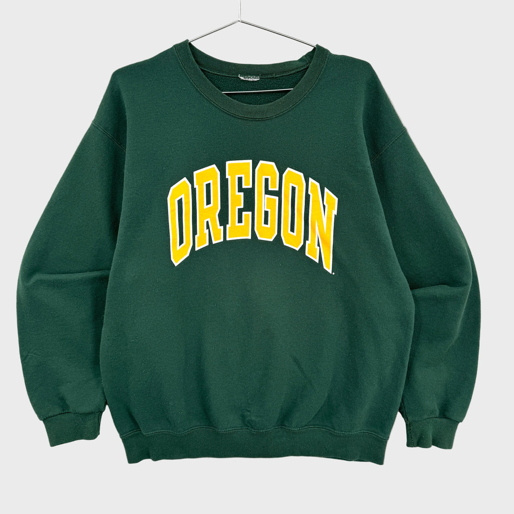 Green sweatshirt with 'OREGON' printed in yellow on a gray background