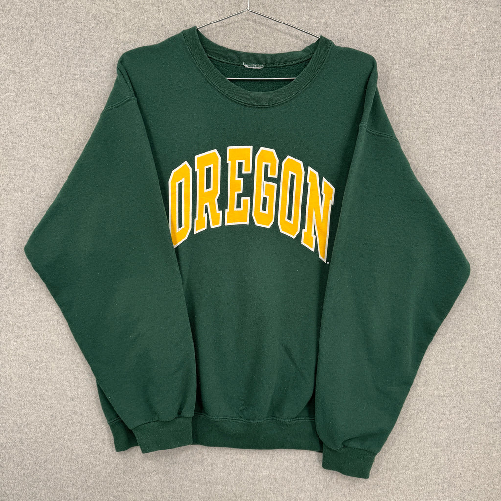 Green sweatshirt with 'OREGON' printed in yellow on a beige background