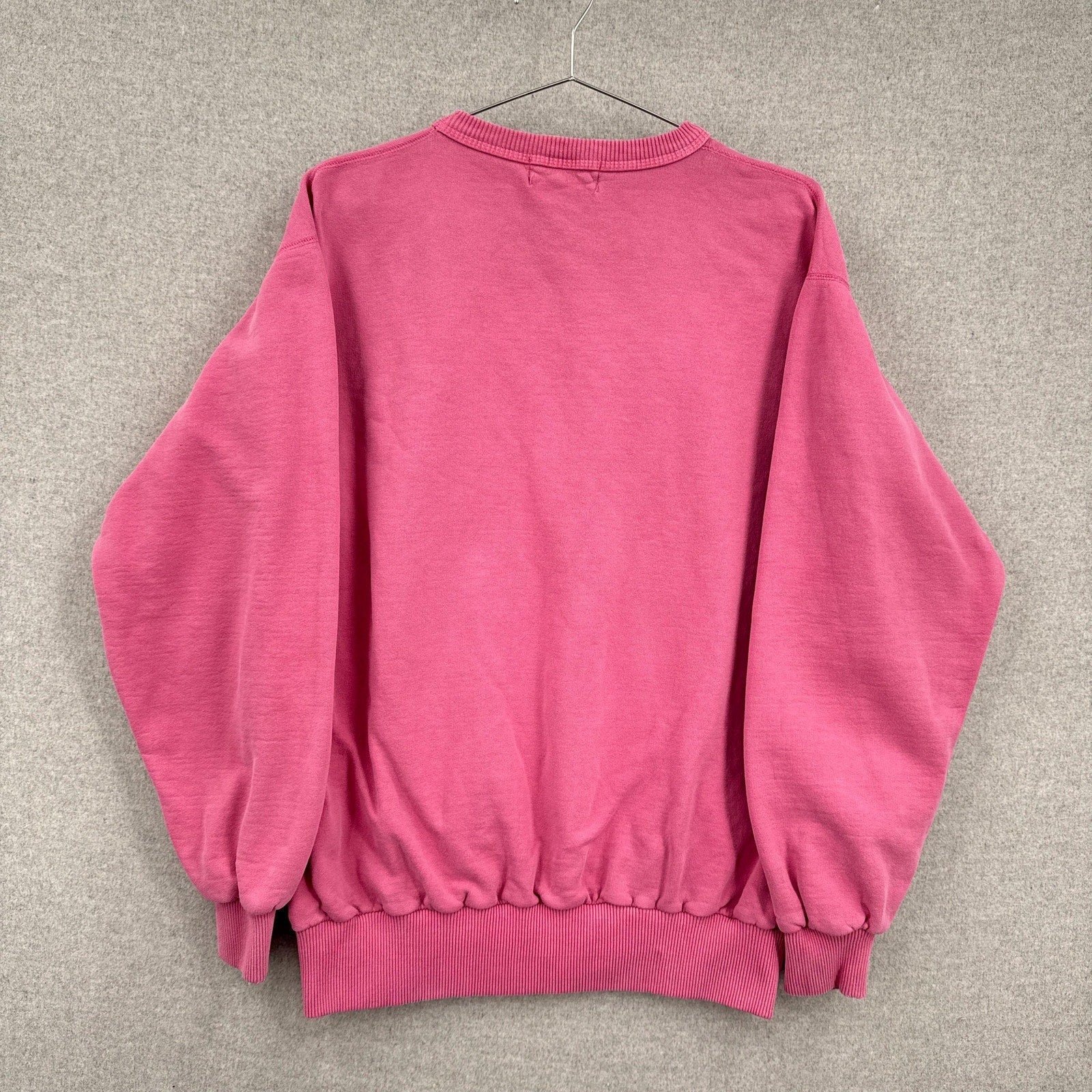 Pink sweatshirt on a gray background