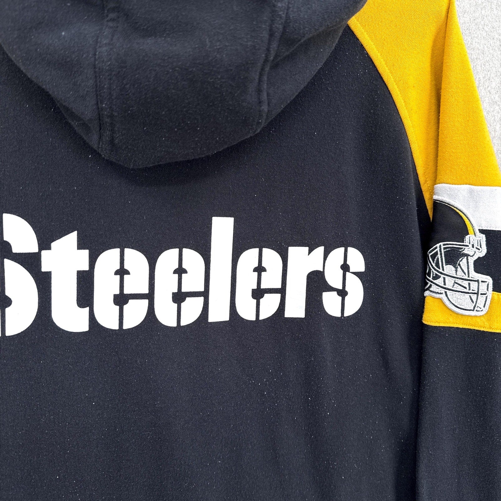 Black hoodie with 'Steelers' text and team logo on sleeve