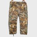 Camouflage-patterned pants on a light gray surface