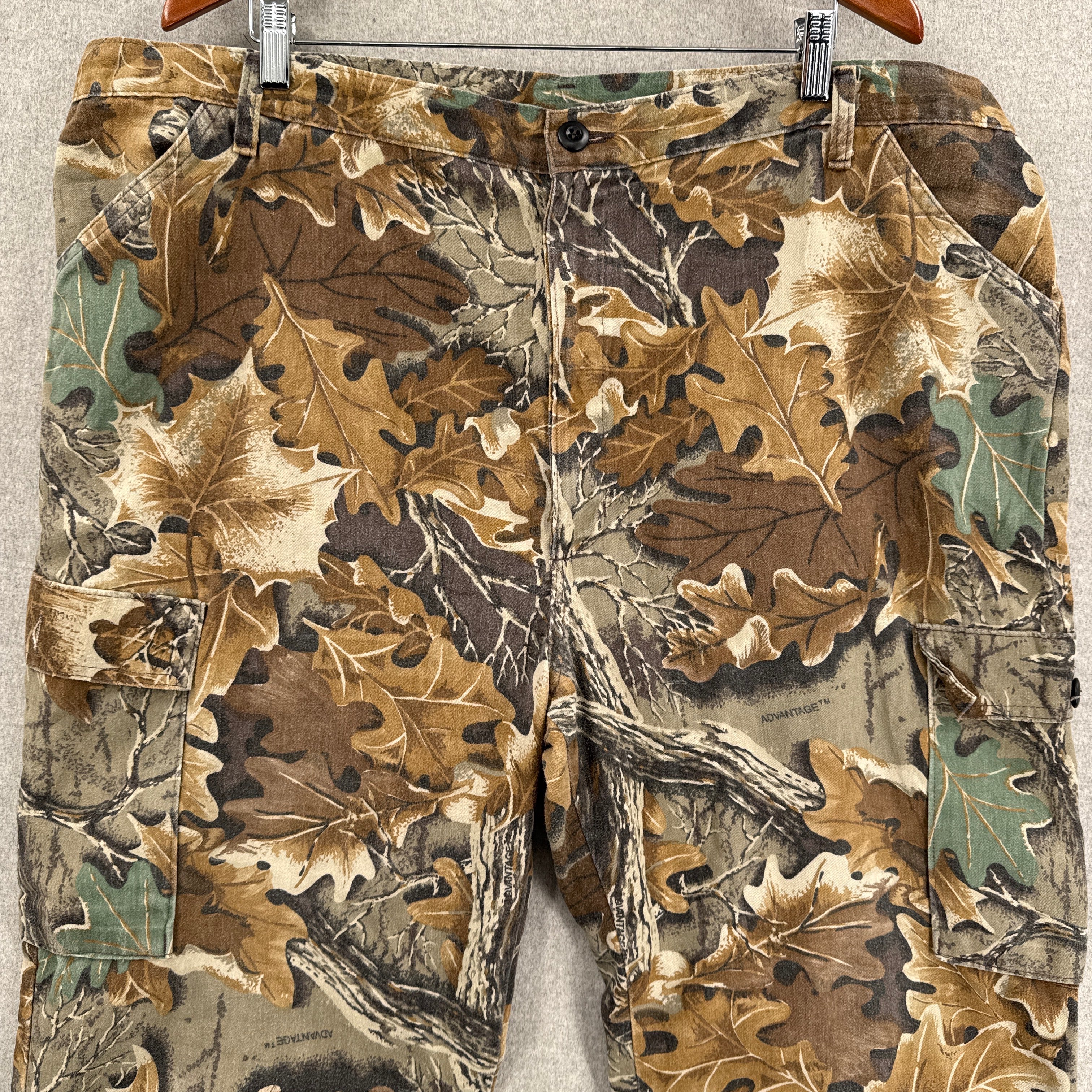 Camouflage pants with realtree pattern on a neutral background