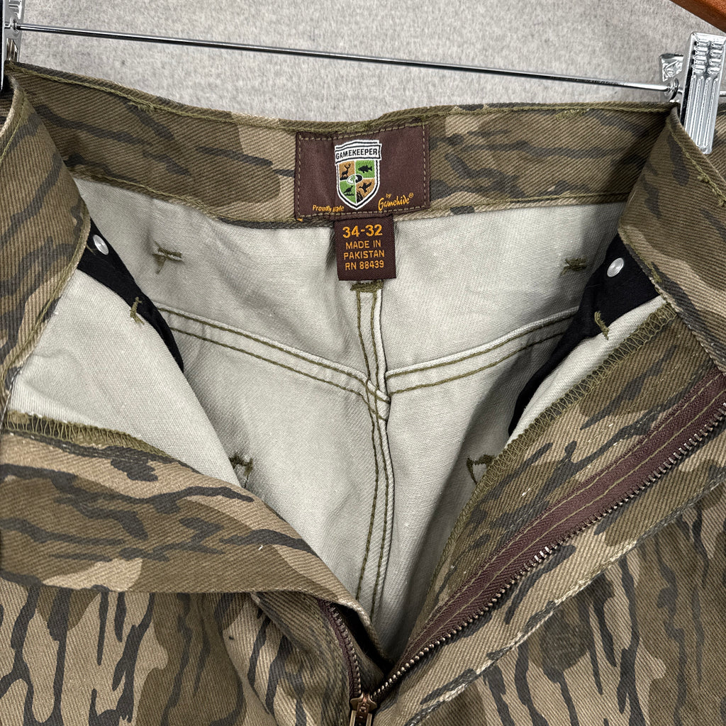 unzipped pants with 34-32 tag