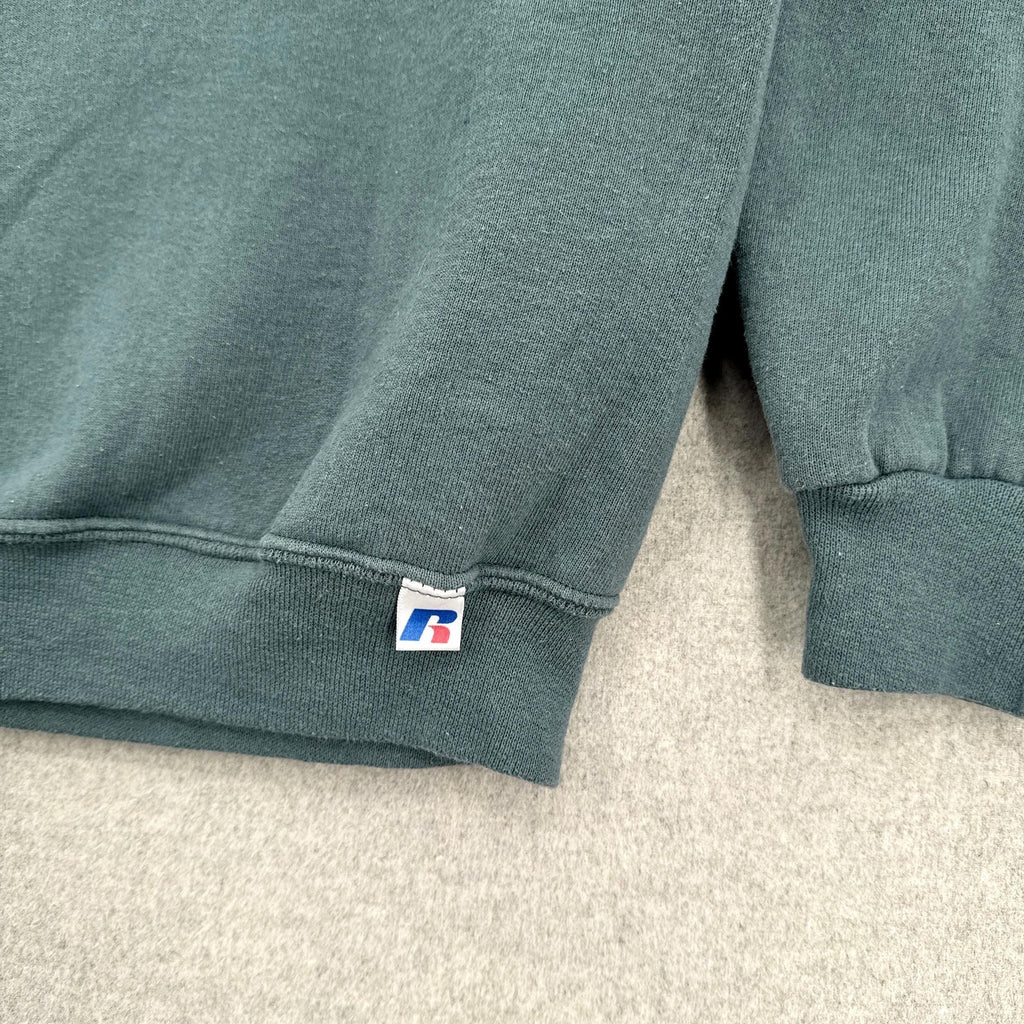 russell tag on the bottom hem of sweatshirt