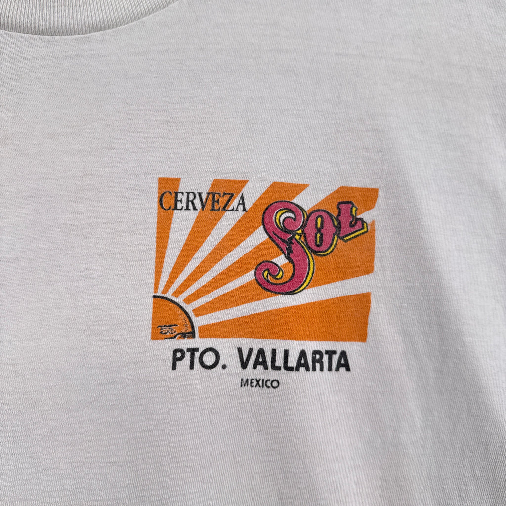 Cerveza logo on a gray shirt with 'Pto. Vallarta, Mexico' text