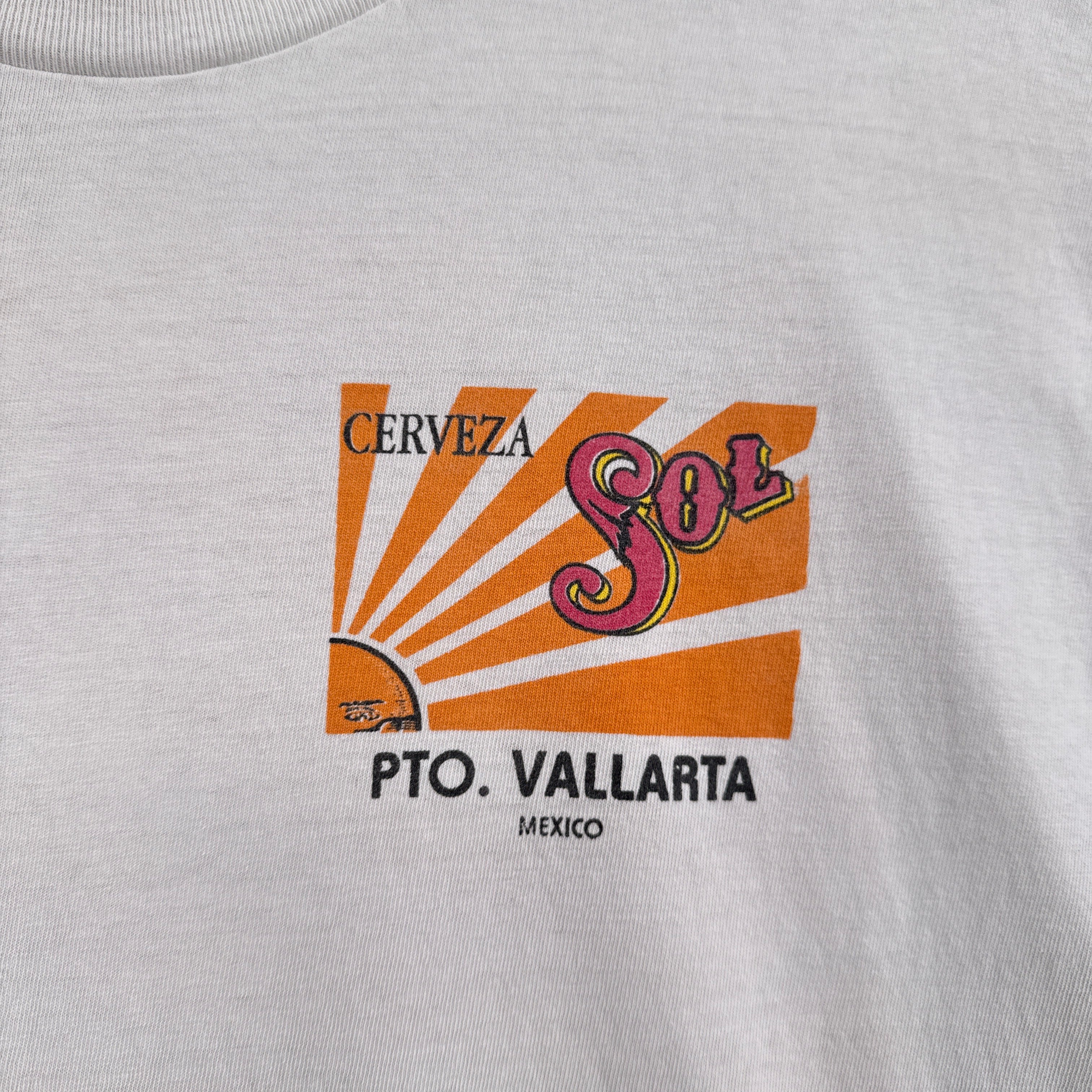 Cerveza logo on a gray shirt with 'Pto. Vallarta, Mexico' text
