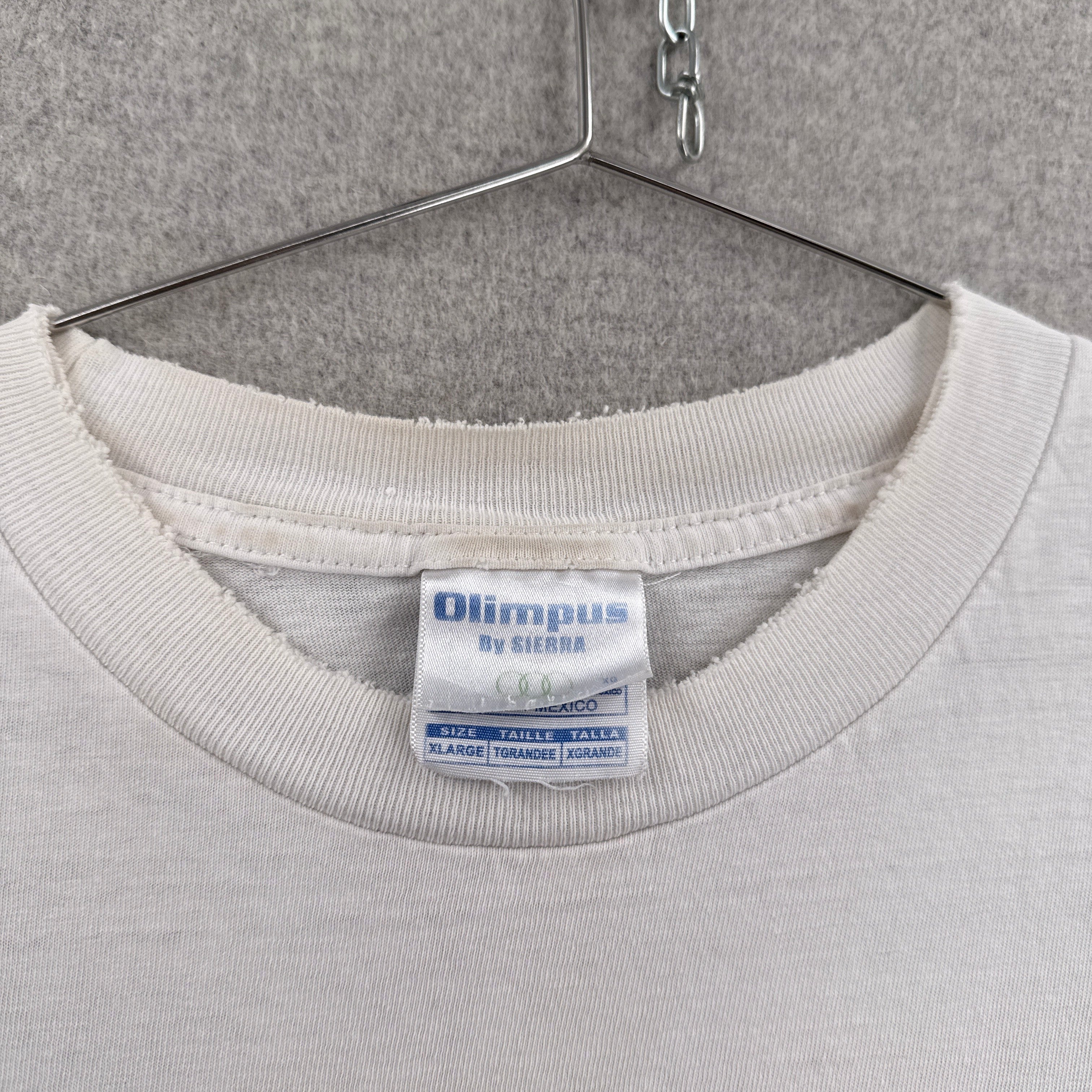 Light gray sweatshirt with a visible label on a hanger against a gray background. tag size XL
