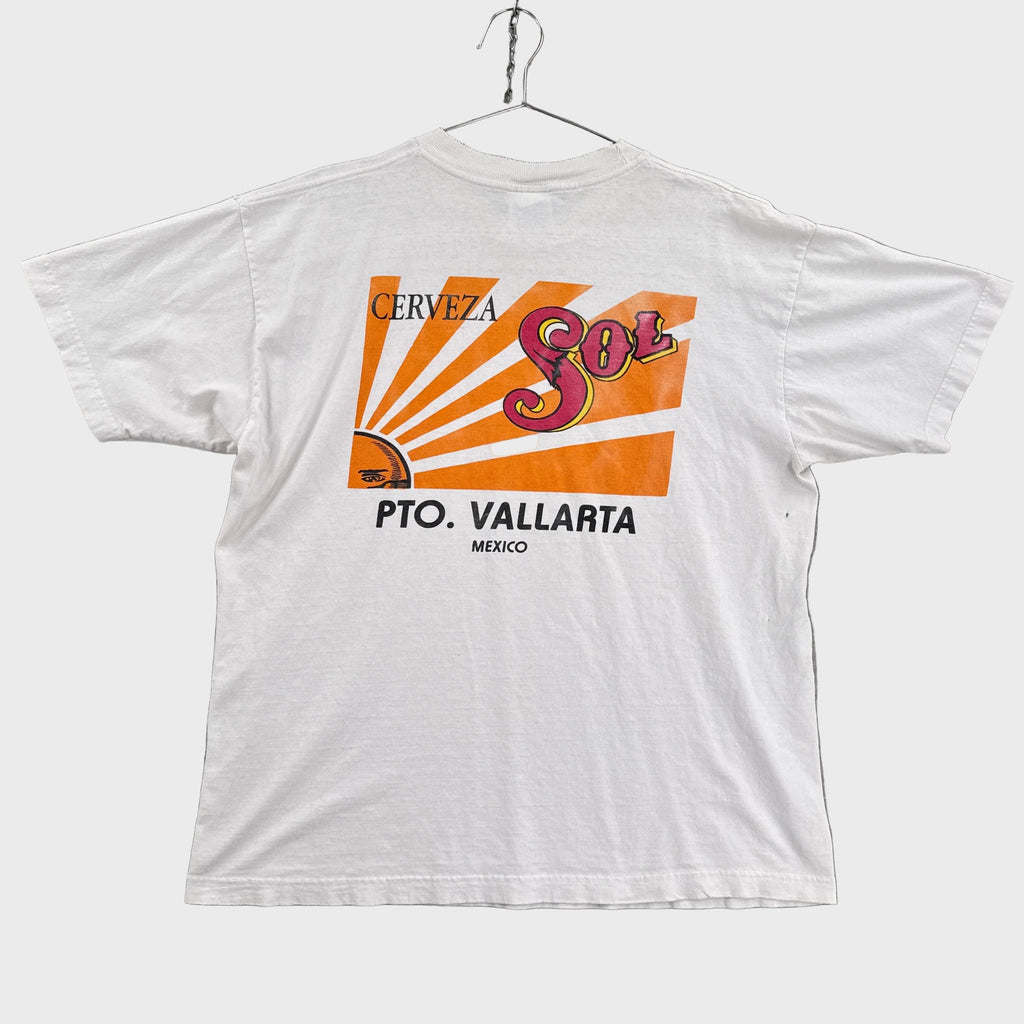 White t-shirt with 'Cerveza Sol' graphic on a gray background. Mexico beer company vacation shirt graphic