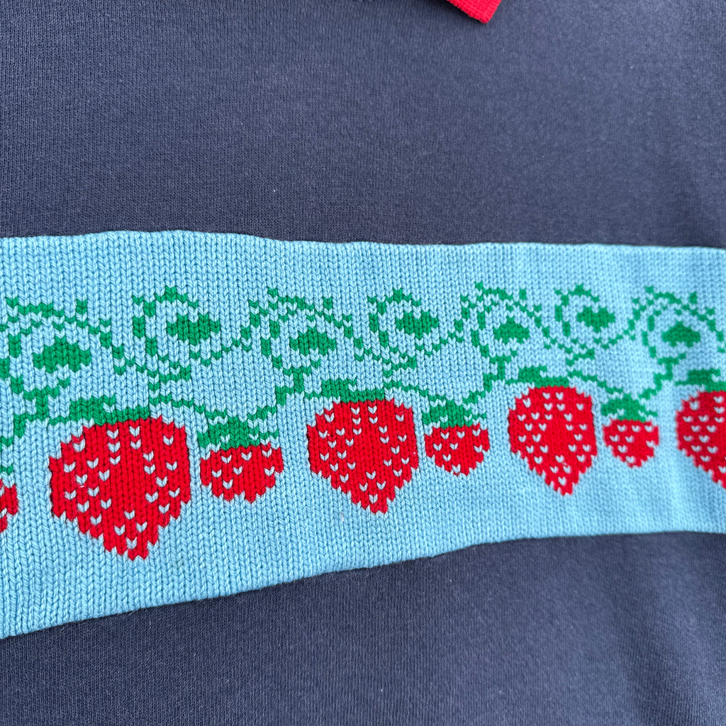 Embroidered red strawberries on sweatshirt