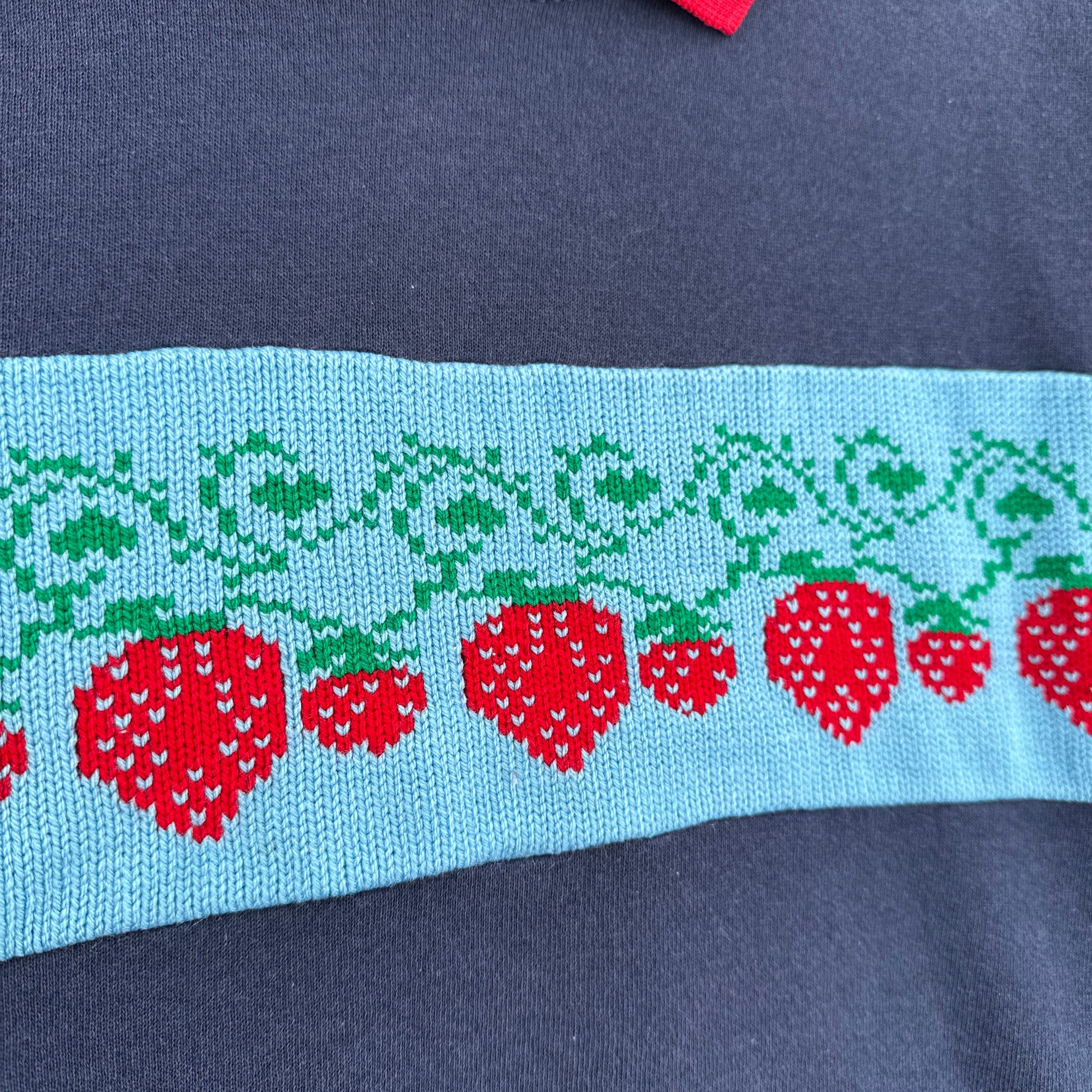 Embroidered red strawberries on sweatshirt